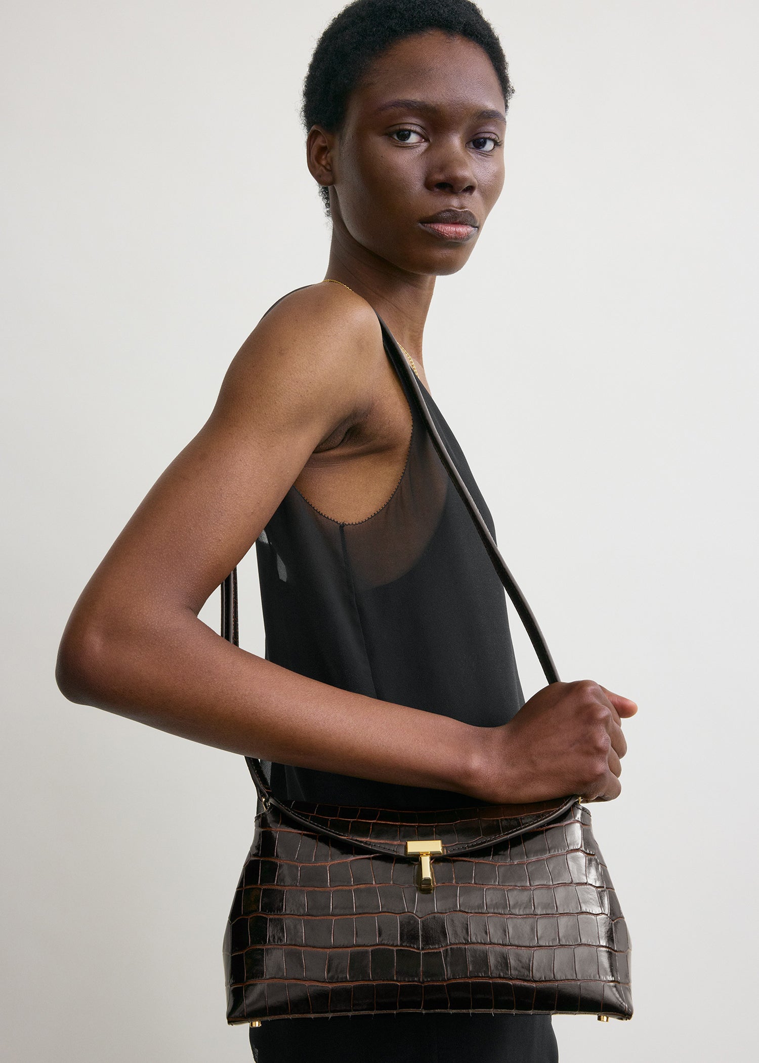 T-lock croco-embossed clutch dark brown