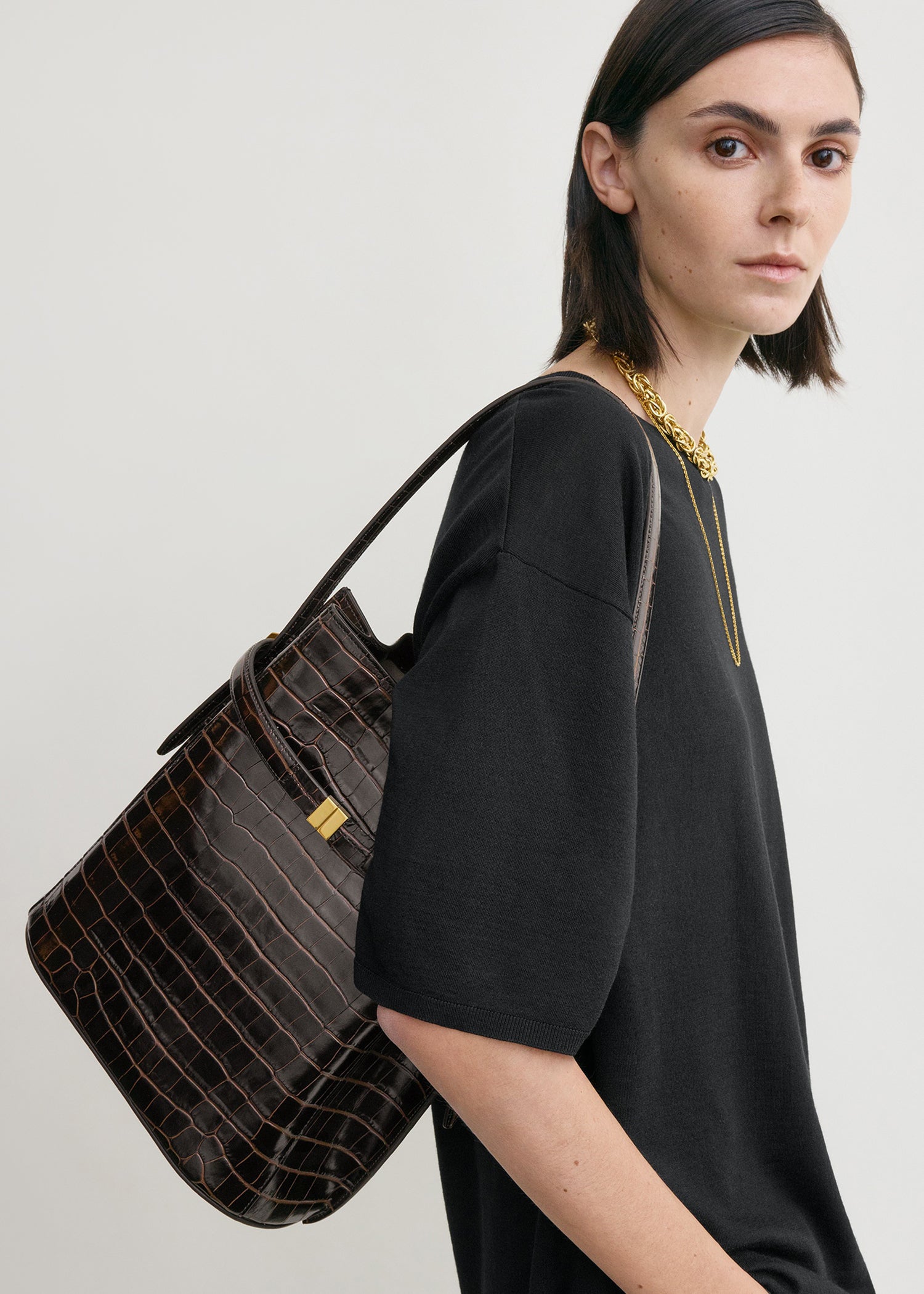 Belted croco-embossed bucket bag dark brown
