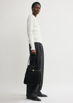 Belted suede bucket bag black
