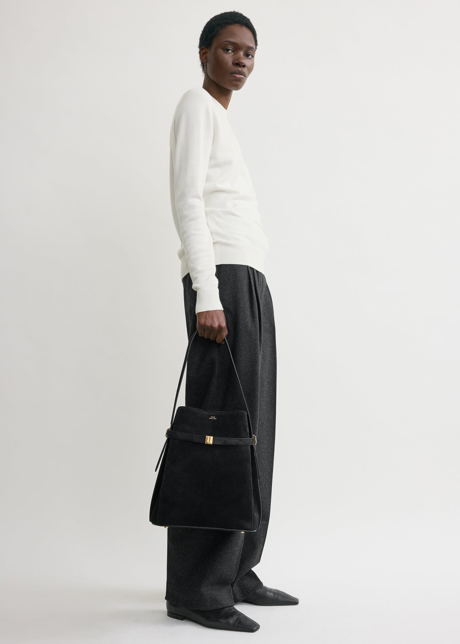 Belted suede bucket bag black