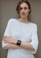 Croco-embossed cuff black