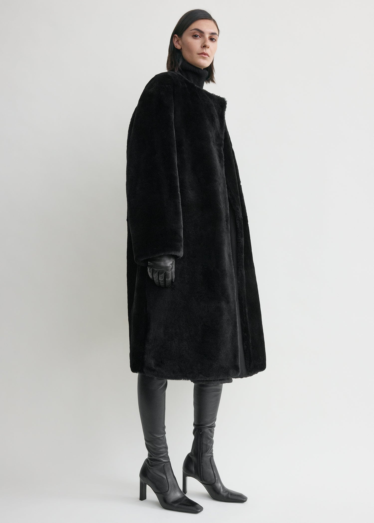 Collarless shearling coat black