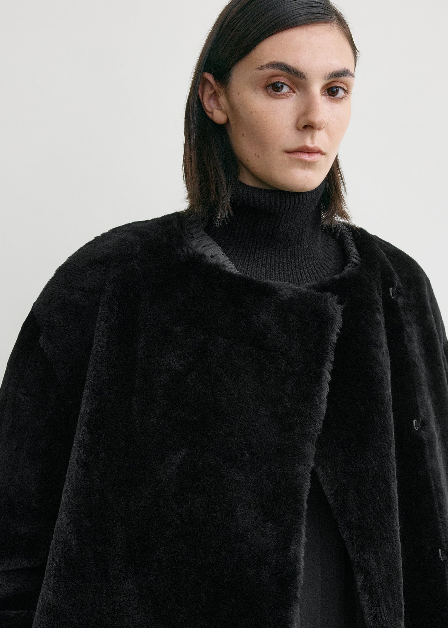 Collarless shearling coat black