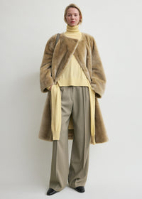 Collarless shearling coat rye