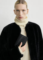 Croco-embossed passport holder black