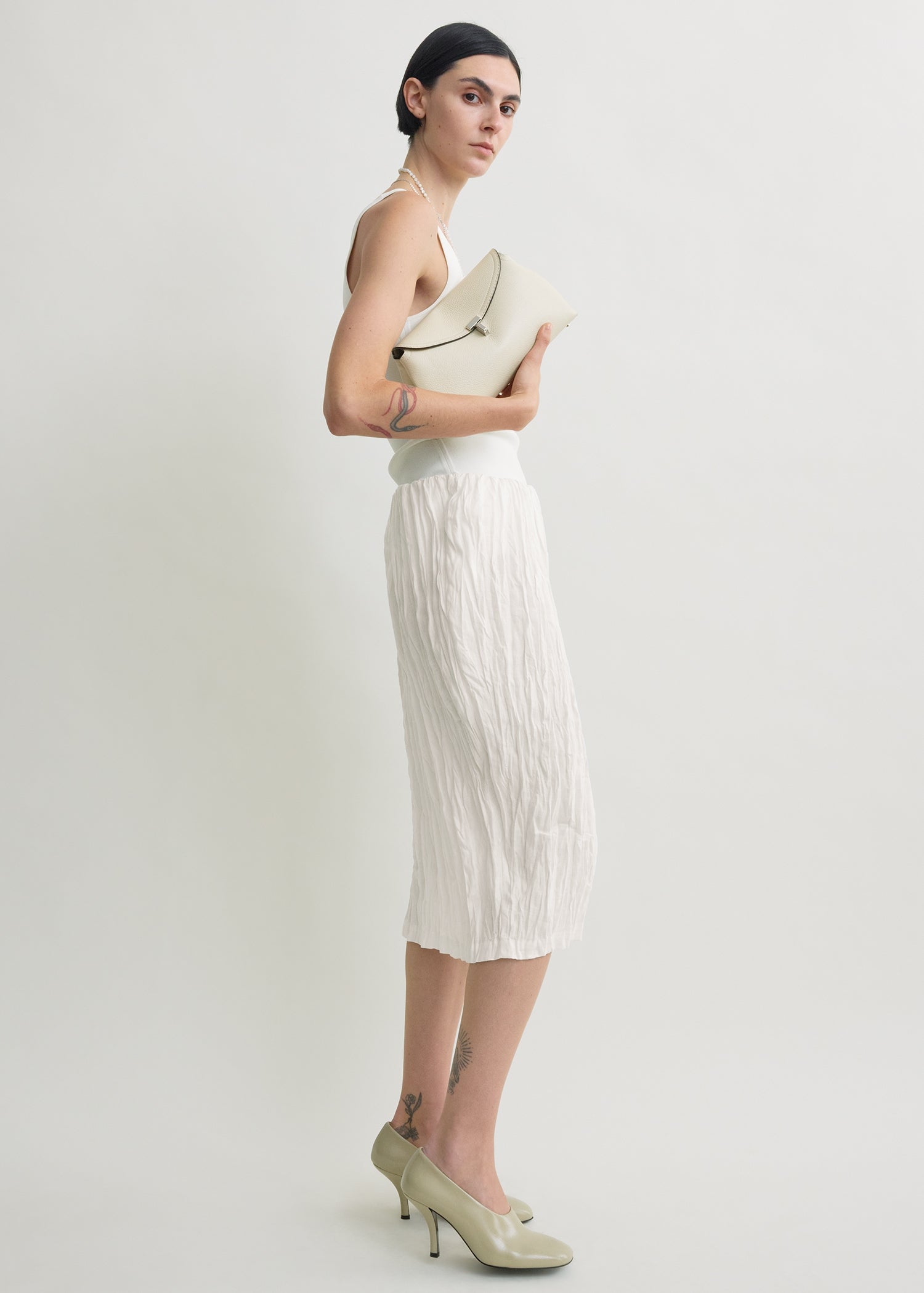 T-lock grained-leather clutch milk