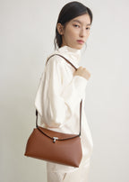 T-lock grained-leather clutch sienna