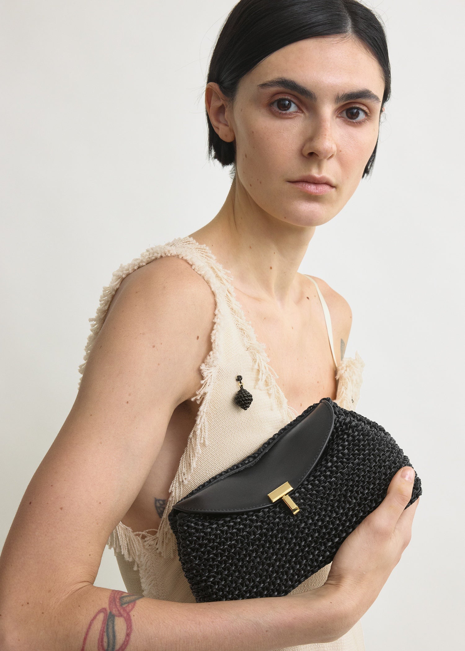 Mini T-lock woven-leather clutch black