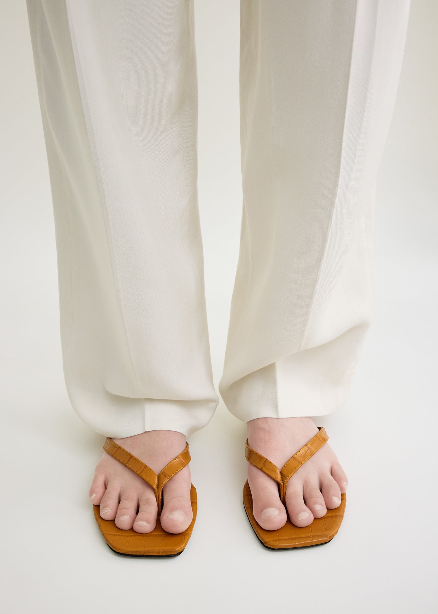 Croco-embossed flip flops tangerine