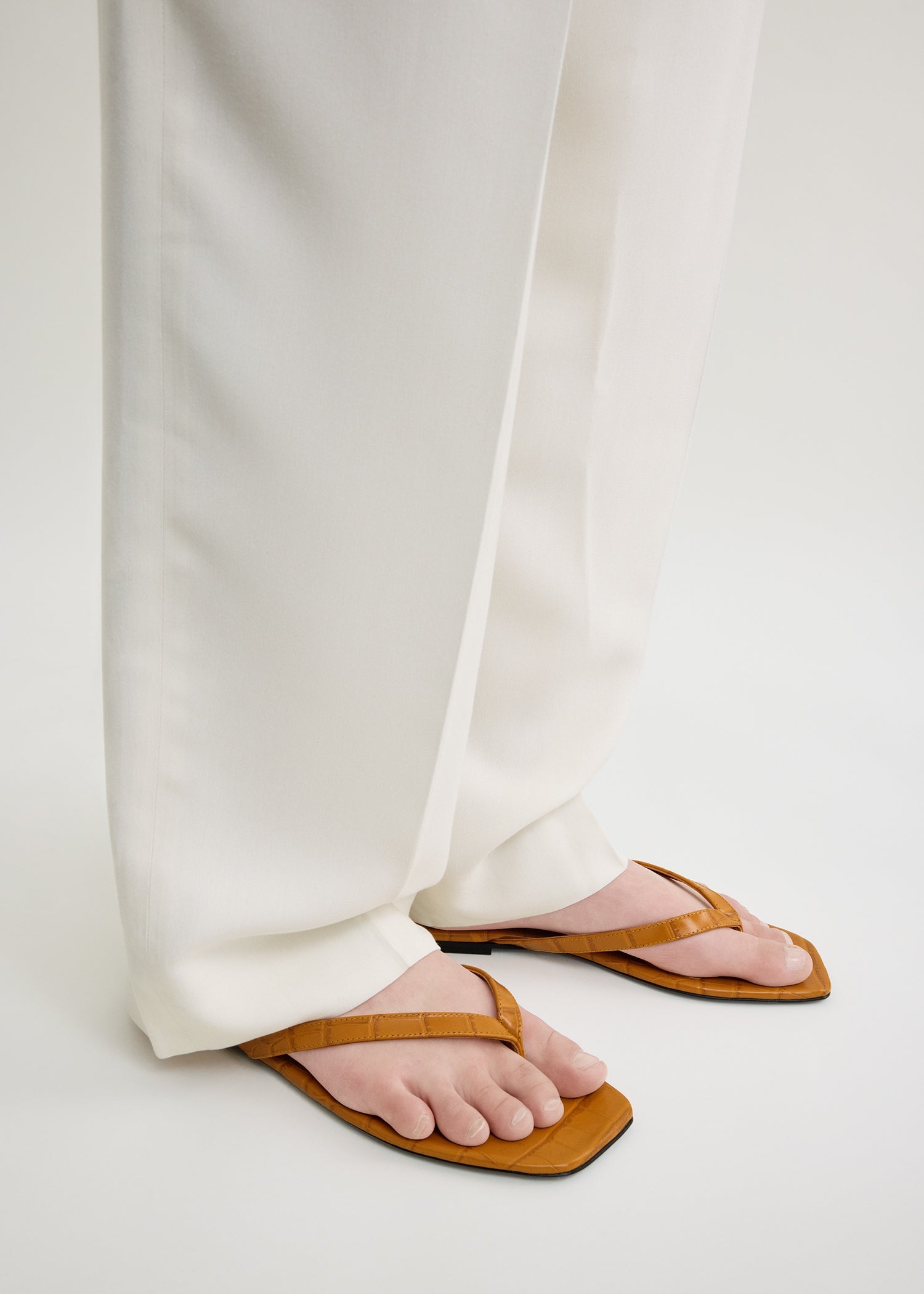 Croco-embossed flip flops tangerine