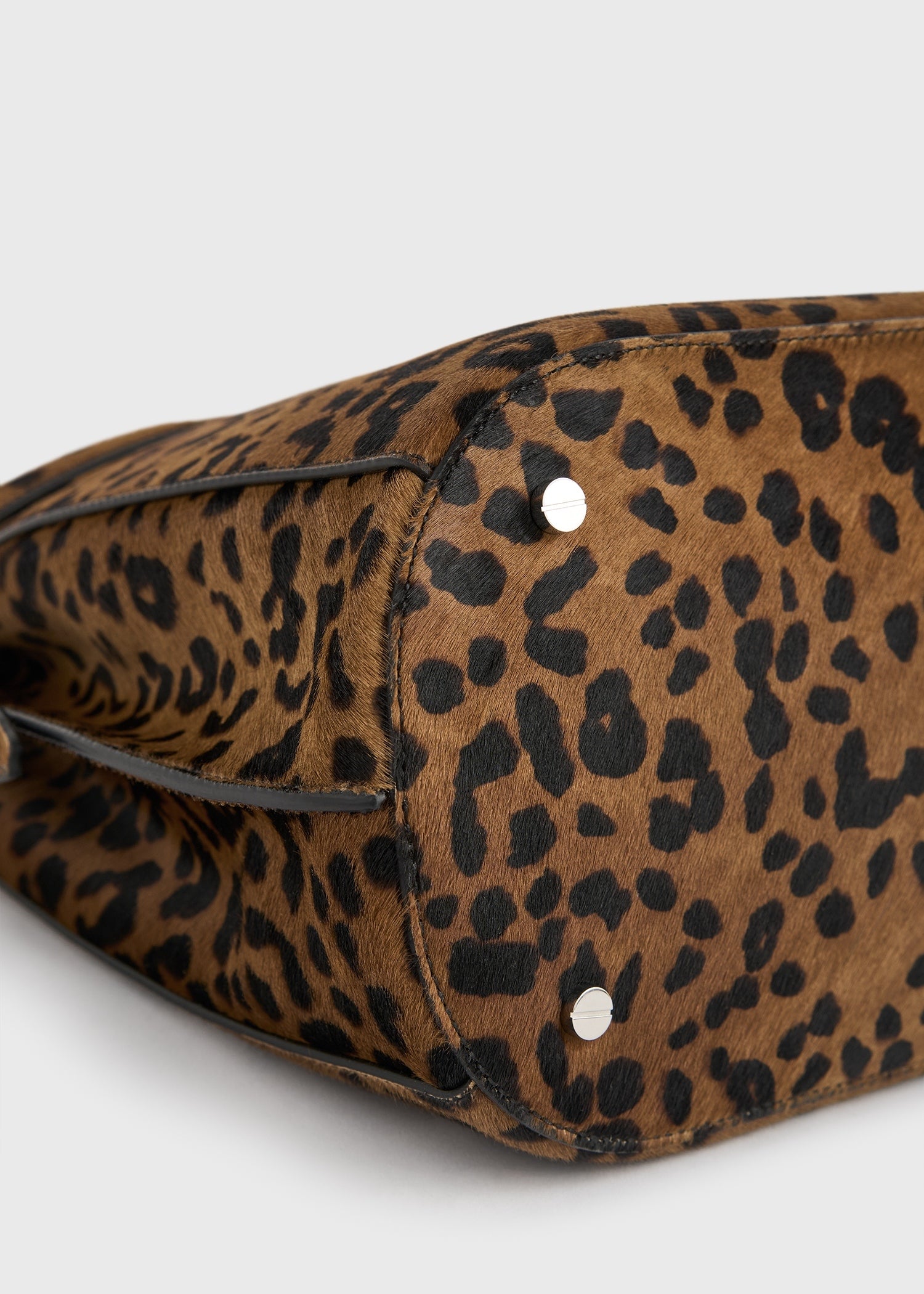 Belted pony hair bucket bag leopard