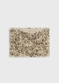 Stracciatella shearling muff black/white