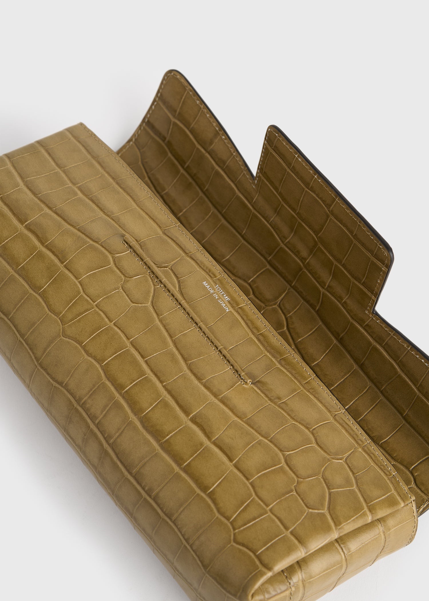 Soft croco-embossed t-clutch biscuit