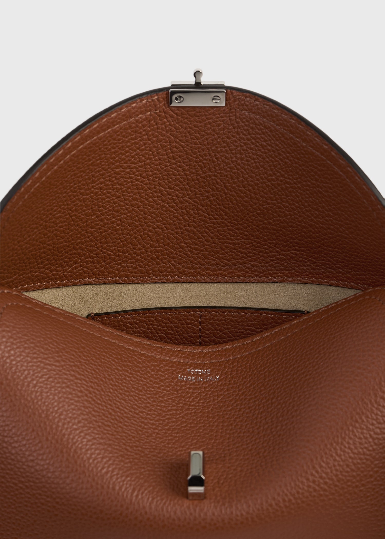 T-lock grained-leather clutch sienna