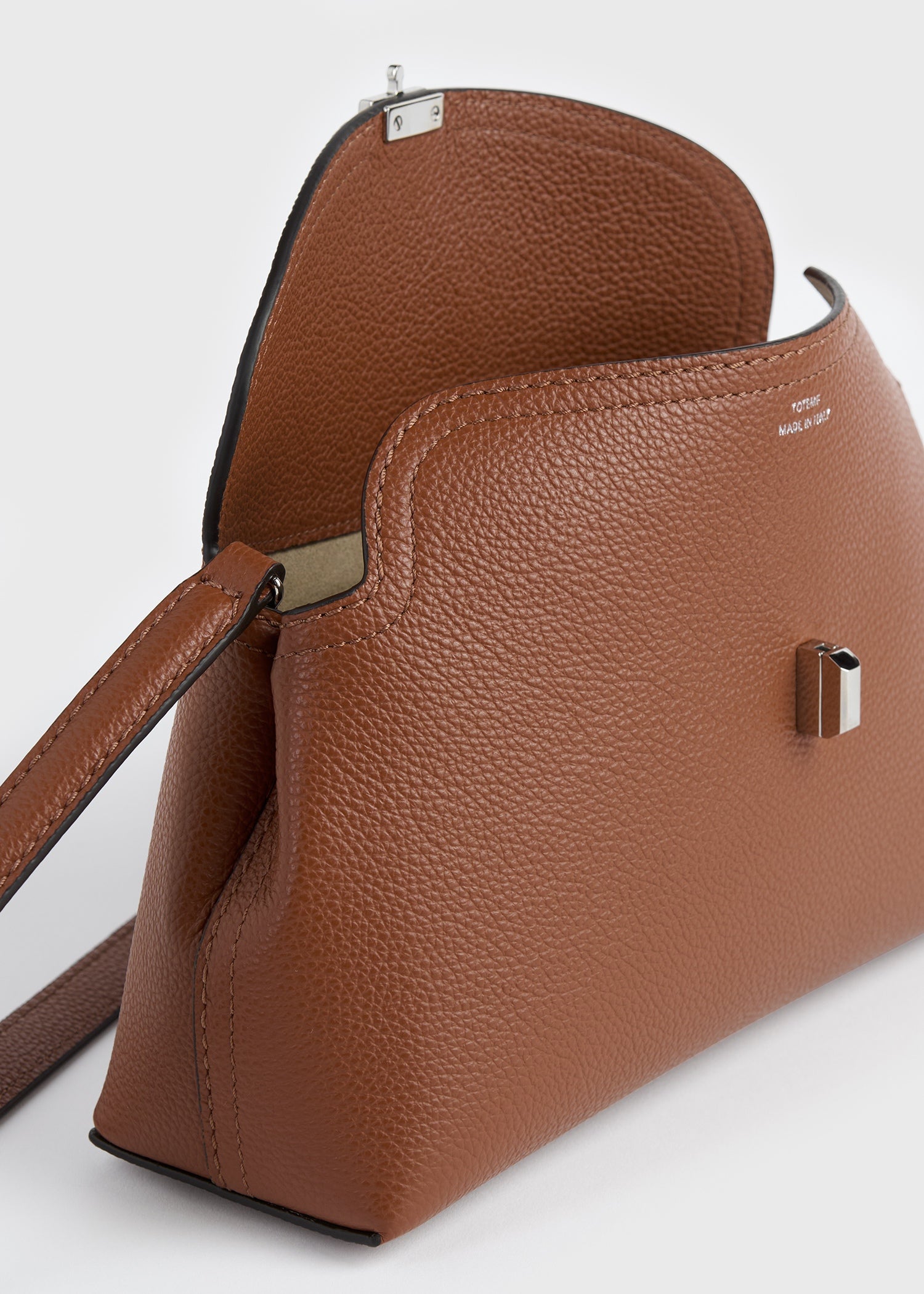 T-lock grained-leather clutch sienna