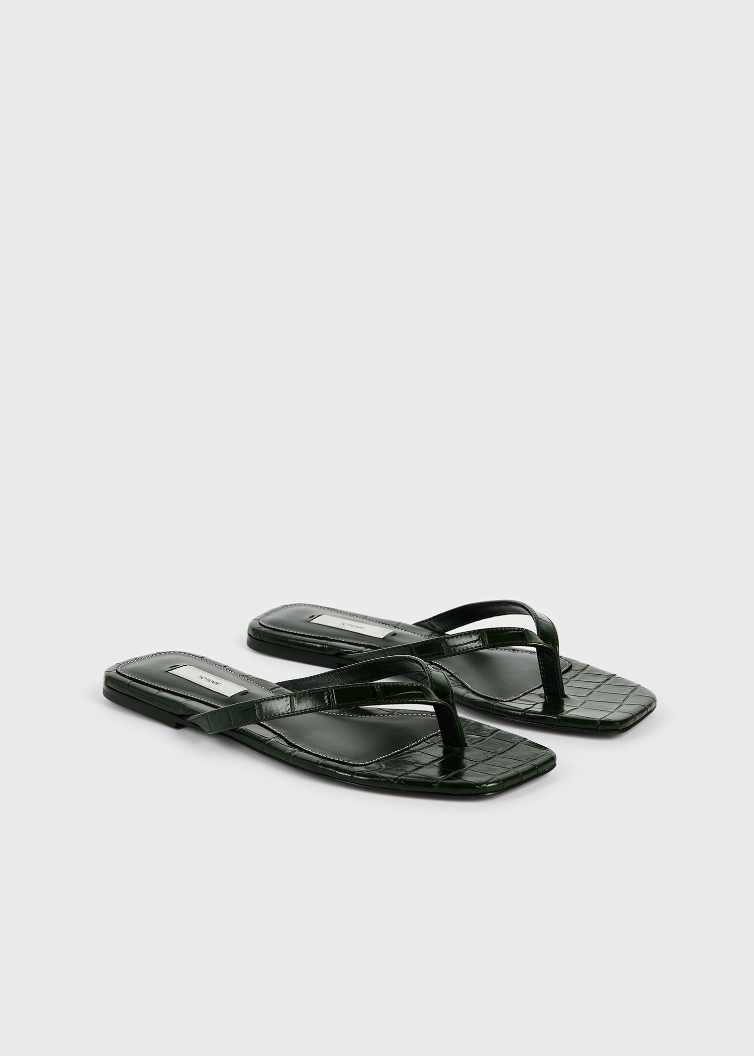 Croco-embossed flip flops dark green