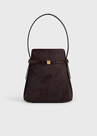 Belted pony hair bucket bag wine