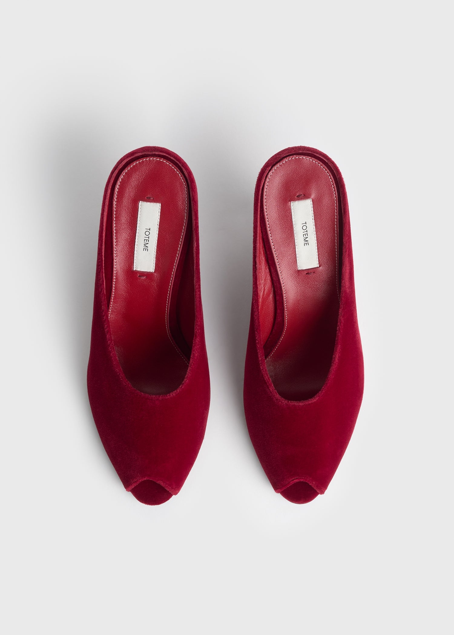 Peep-toe velvet wedge mules red
