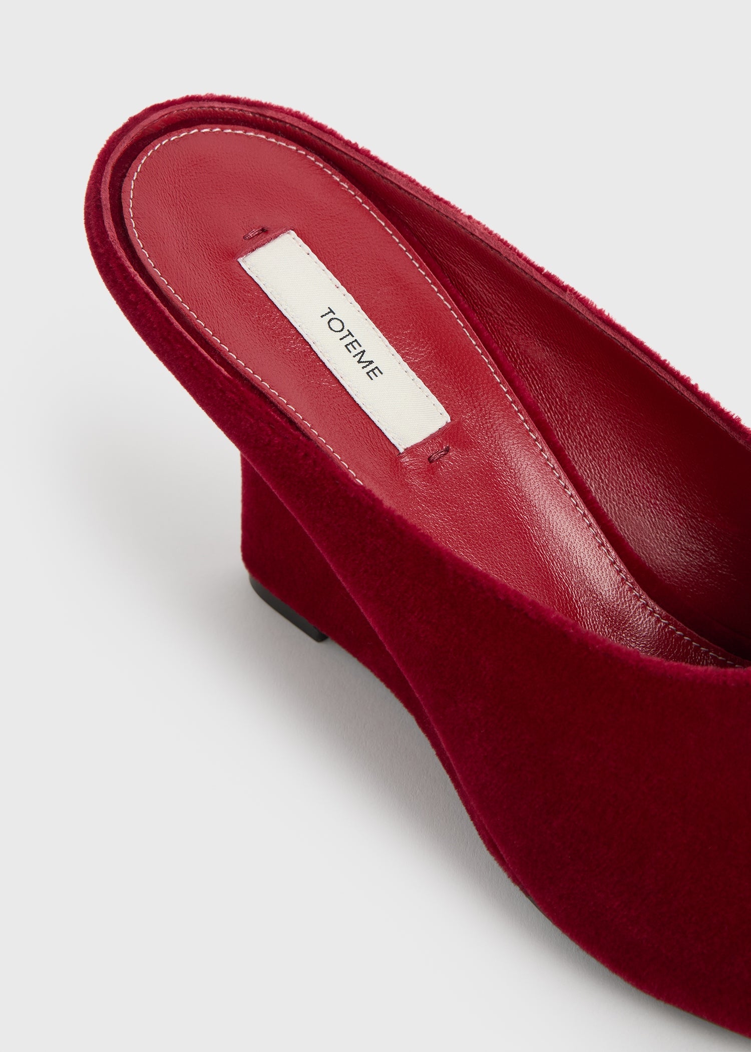 Peep-toe velvet wedge mules red