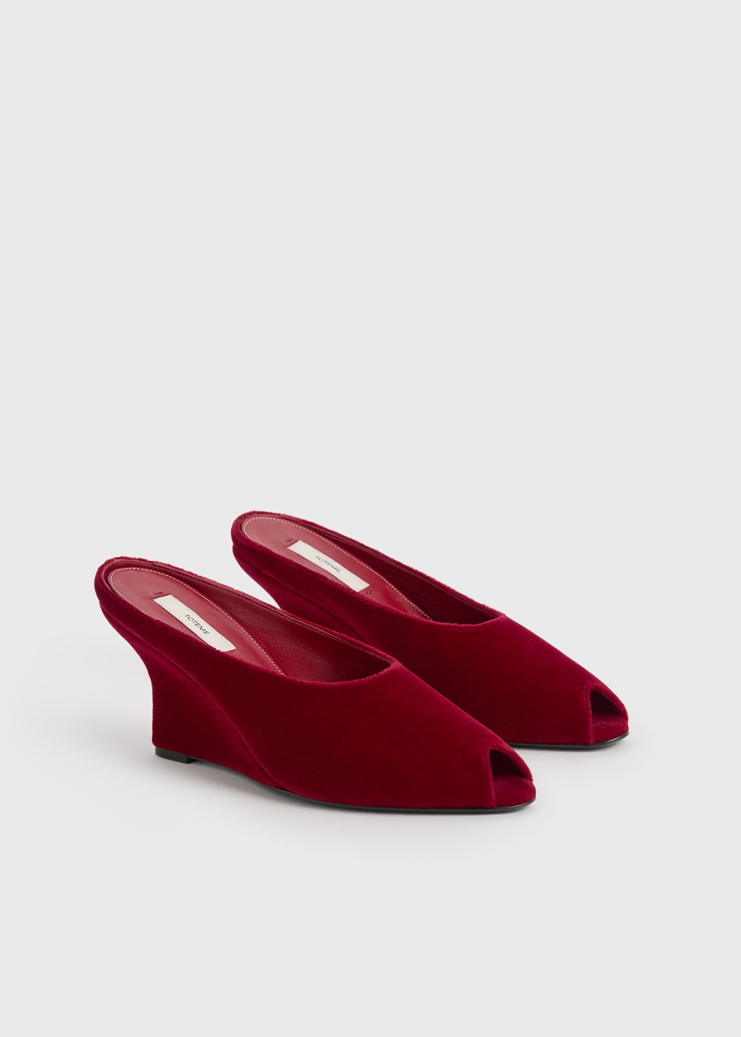 Peep-toe velvet wedge mules red