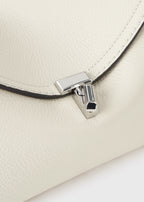 T-lock grained-leather clutch milk