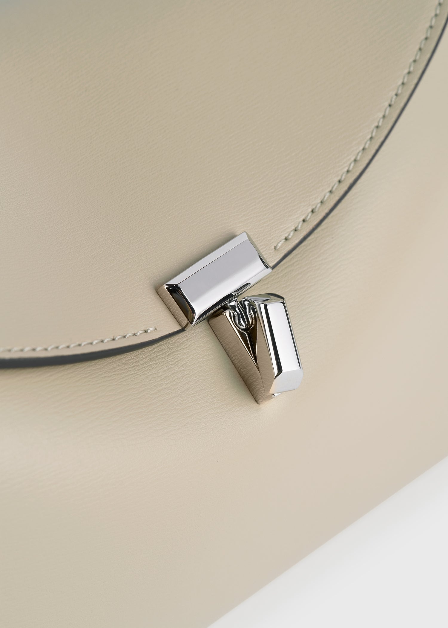 T-lock leather clutch fawn