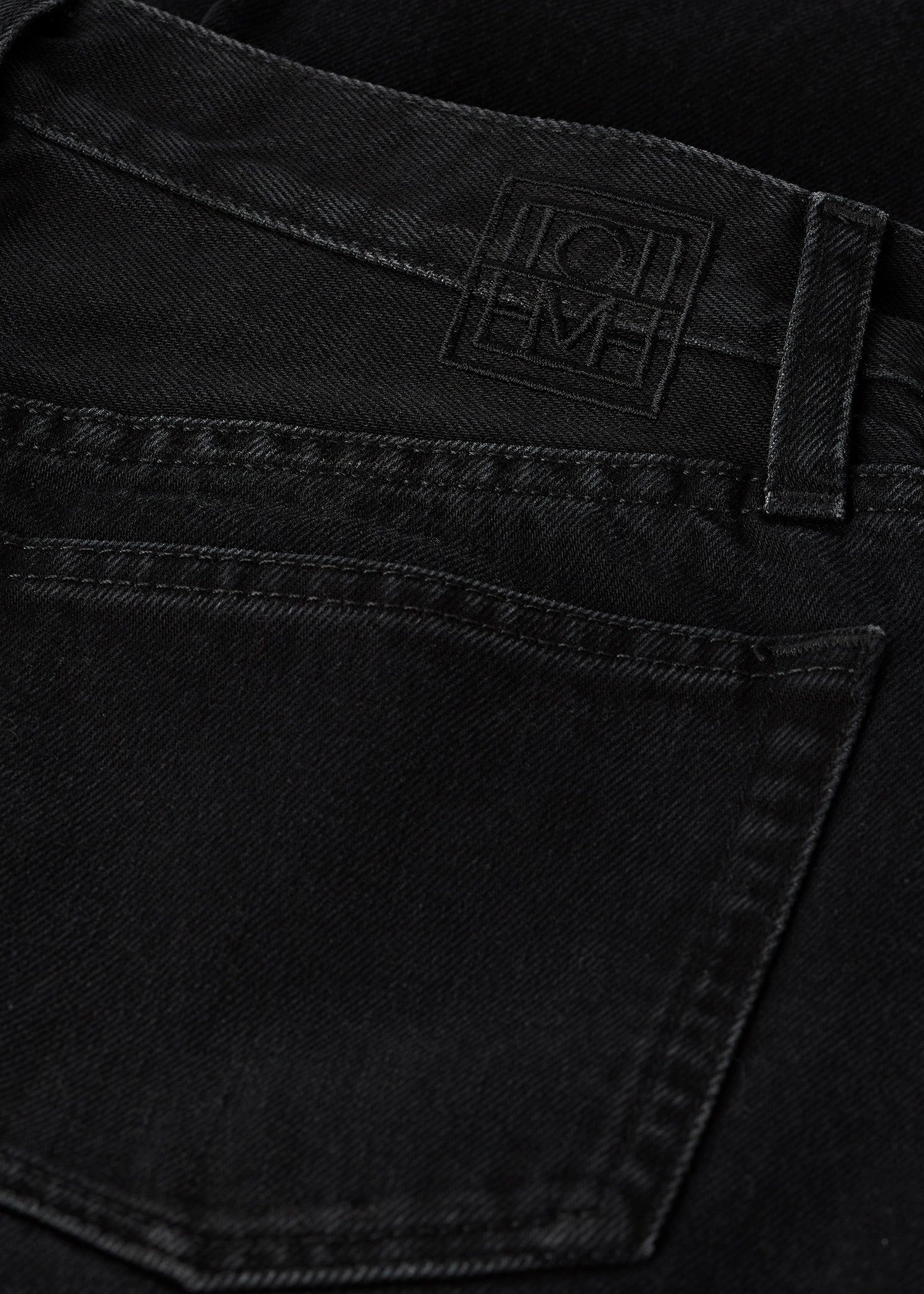 Twisted seam denim full length faded black