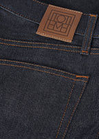 Twisted seam denim full length raw blue